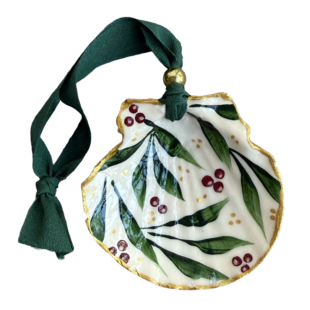 Decorative ornament with green leaves and red berries on a white background