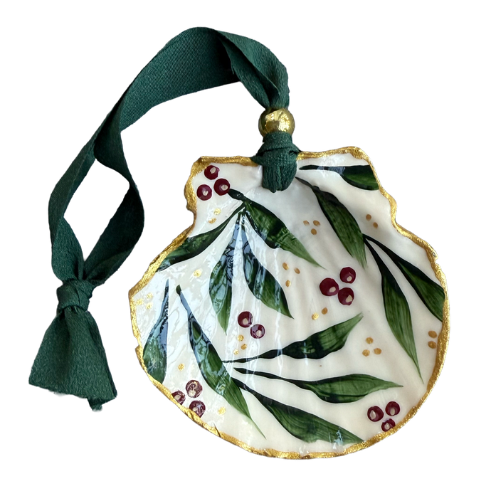 Decorative ornament with green leaves and red berries on a white background