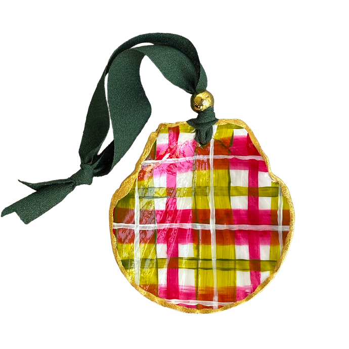 Colorful plaid painted shell ornament with a green ribbon on a white background