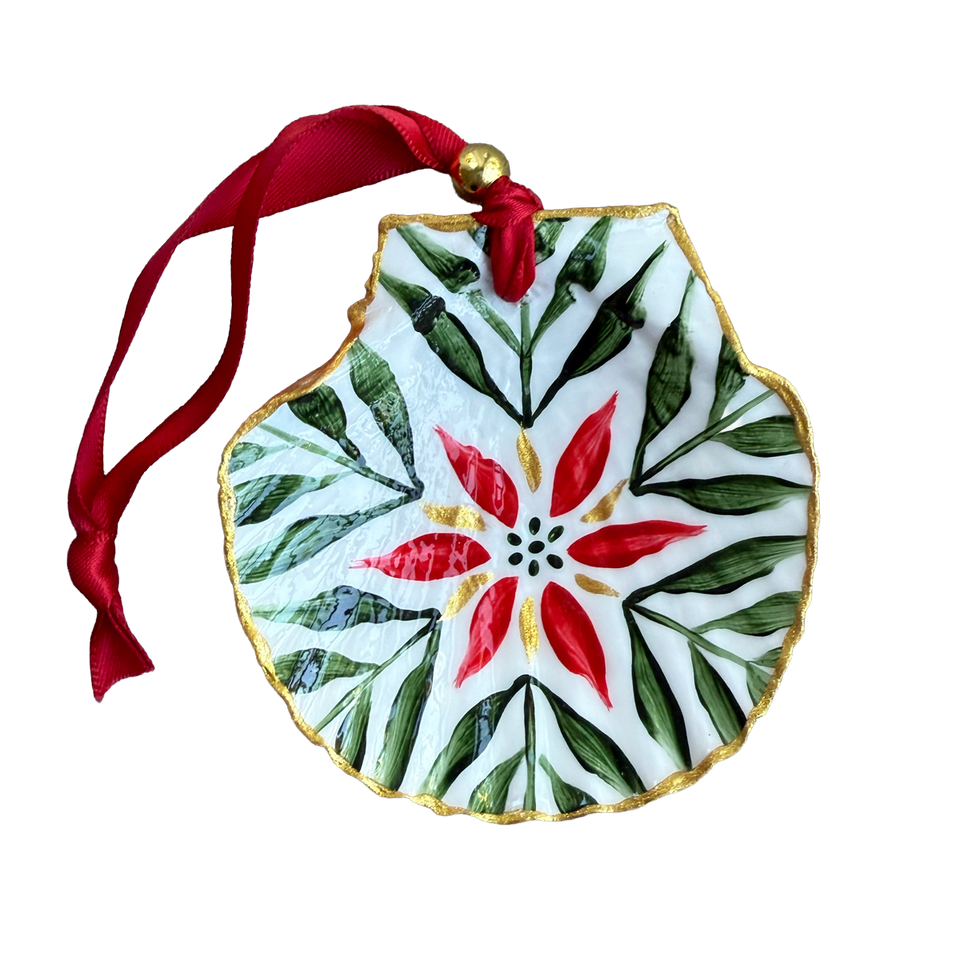 Decorative ornament with red flower design and green leaves on a white background